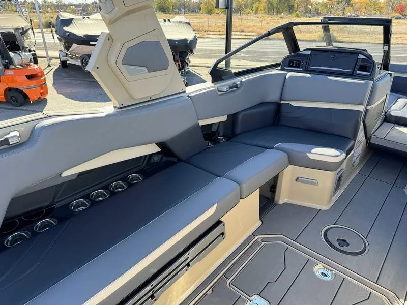 Slide: The Image of 2025 Supra SE boat interior with sleek seating and modern design. - 9
