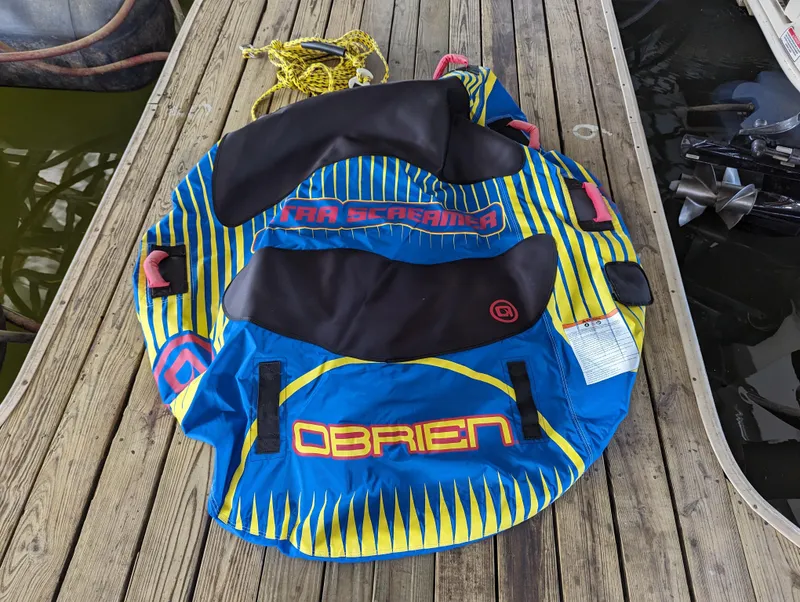 Slide: The Image of O'Brien inflatable water tube on wooden dock near 2006 Sea Ray 240 Sundeck. - 20