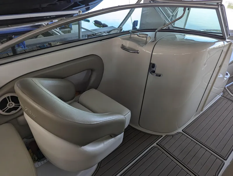 Slide: The Image of Interior view of 2006 Sea Ray 240 Sundeck boat with seating and sleek design. - 28