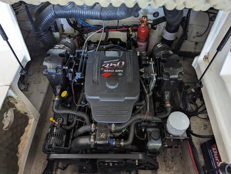 Slide: The Image of 2006 Sea Ray 240 Sundeck engine compartment with MerCruiser 350 MAG MPI engine. - 30