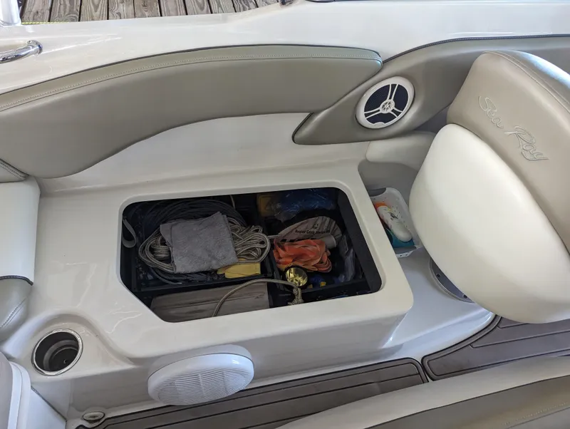 Slide: The Image of Storage compartment on 2006 Sea Ray 240 Sundeck boat with ropes and accessories. - 34