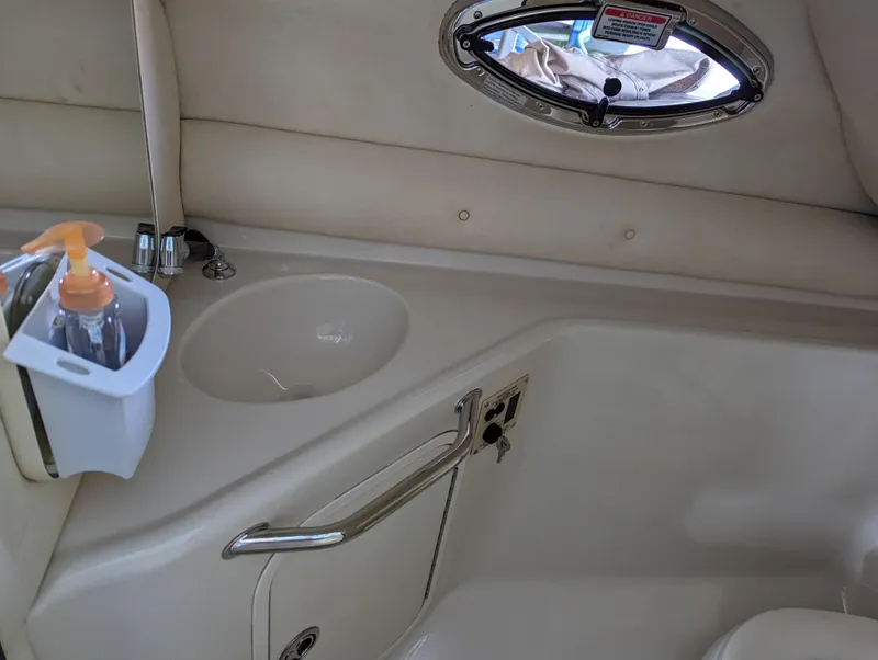 Slide: The Image of Interior of 2006 Sea Ray 240 Sundeck boat with sink and porthole. - 36