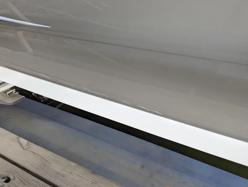 Slide: The Image of Close-up of 2006 Sea Ray 240 Sundeck boat hull on dock. - 4