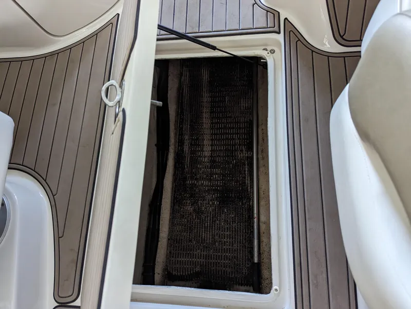 Slide: The Image of Open storage compartment on 2006 Sea Ray 240 Sundeck boat deck. - 41