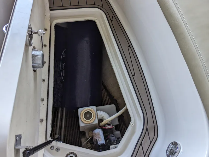 Slide: The Image of Storage compartment of 2006 Sea Ray 240 Sundeck boat, showing interior details. - 43