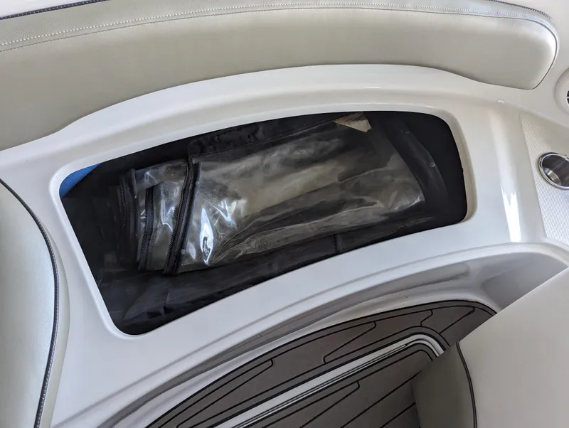 Slide: The Image of Storage compartment in 2006 Sea Ray 240 Sundeck boat interior. - 47