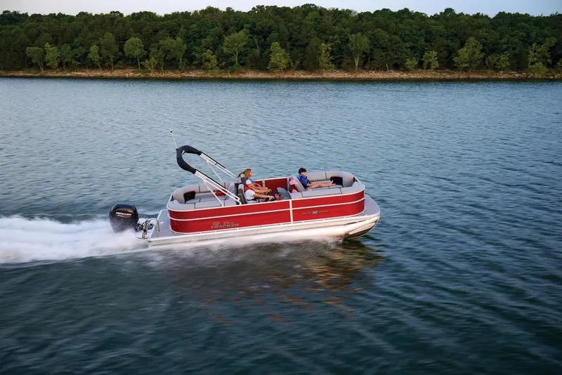 Slide: The Image of 2025 Sun Tracker Party Barge 22 DLX cruising on a serene lake. - 35