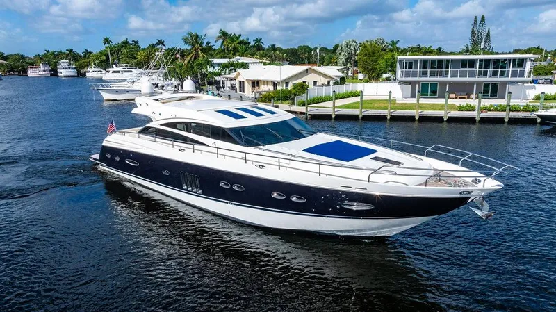 Slide: The Image of Luxurious 2010 Princess V78 yacht cruising on a scenic waterway. - 11