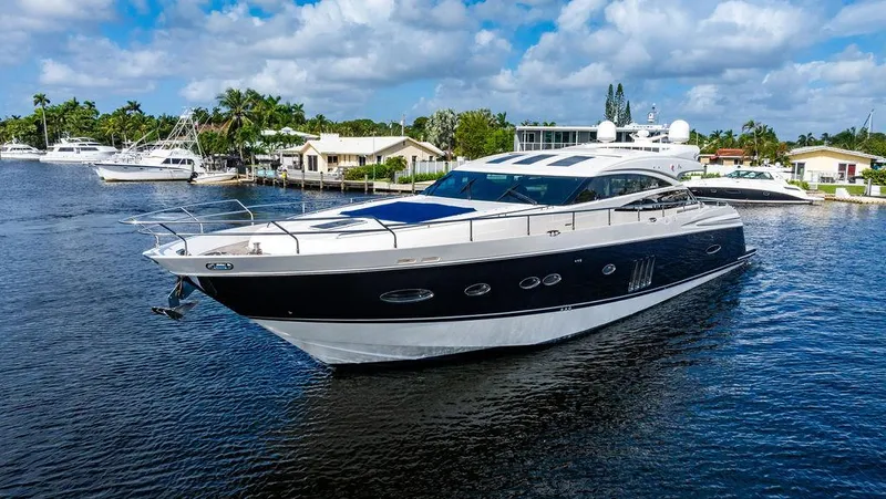 Slide: The Image of Luxurious 2010 Princess V78 yacht cruising on a serene waterway. - 13