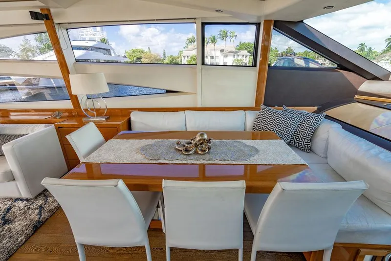 Slide: The Image of Luxurious 2010 Princess V78 yacht interior with elegant dining area and scenic windows. - 23