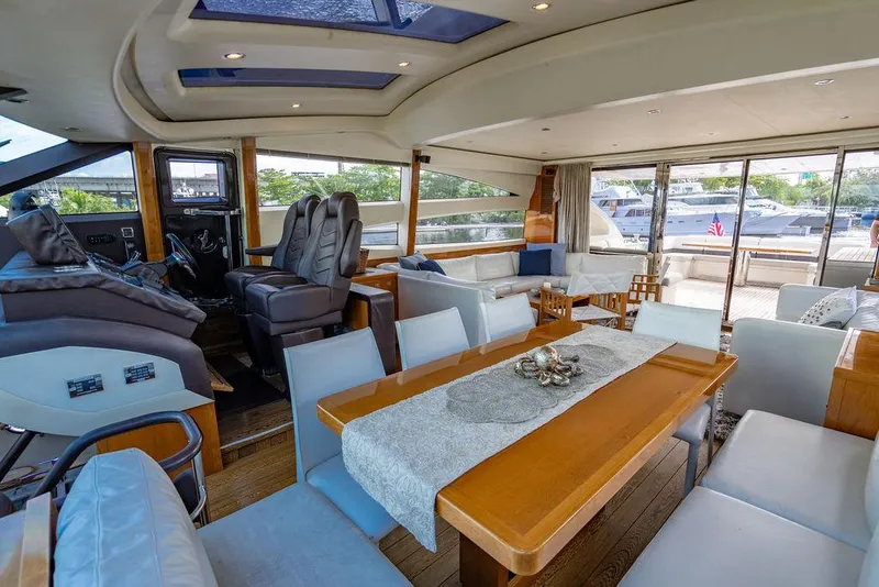 Slide: The Image of Luxurious interior of 2010 Princess V78 yacht with elegant seating and dining area. - 33