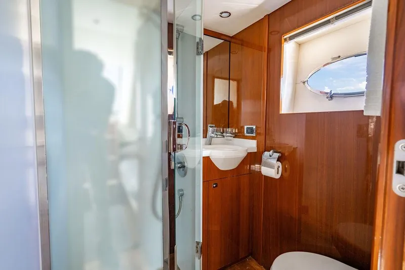Slide: The Image of Luxurious bathroom in 2010 Princess V78 yacht with wooden accents and modern fixtures. - 41
