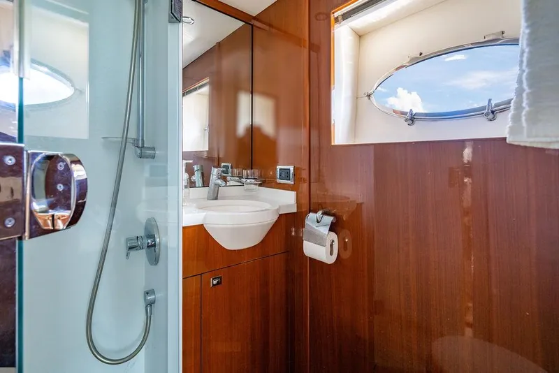 Slide: The Image of Luxurious bathroom in 2010 Princess V78 yacht with wood paneling and modern fixtures. - 42
