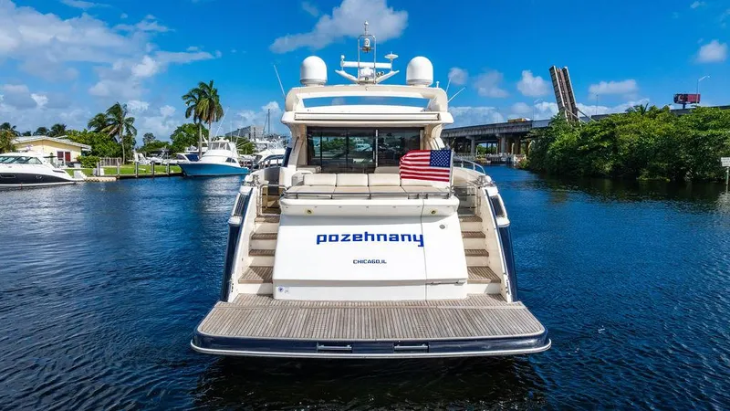 Slide: The Image of Luxury 2010 Princess V78 yacht on a scenic waterway with American flag. - 7