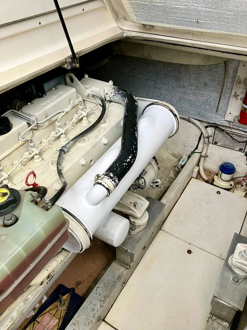 Slide: The Image of 1999 Henriques 28 Express engine compartment with visible components and wiring. - 19