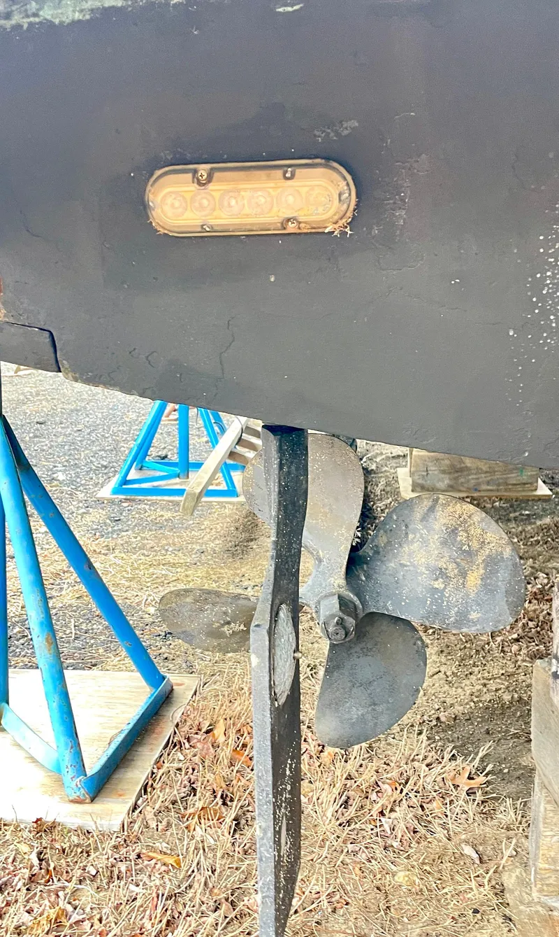 Slide: The Image of 1999 Henriques 28 Express boat propeller and hull detail. - 23