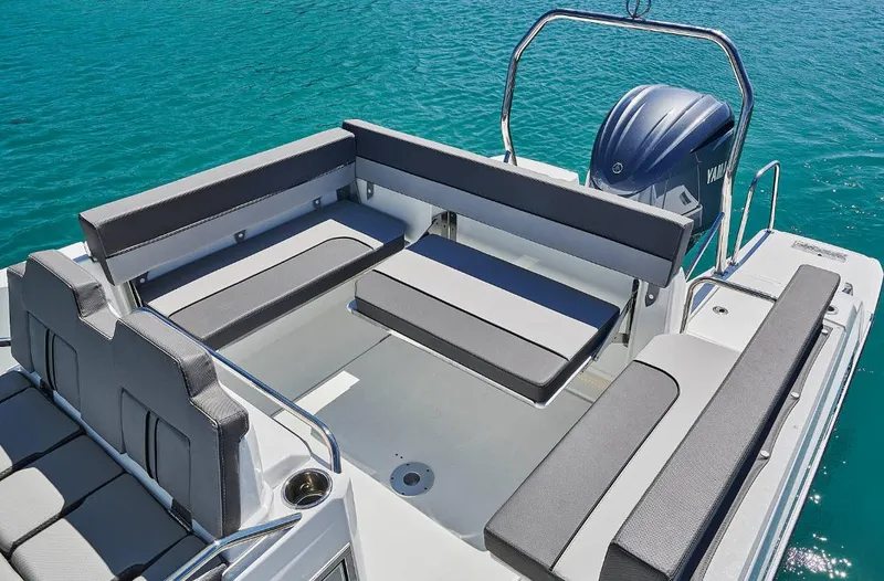 Slide: The Image of 2023 Jeanneau Leader 7.5CC S3 boat with spacious seating on clear blue water. - 5