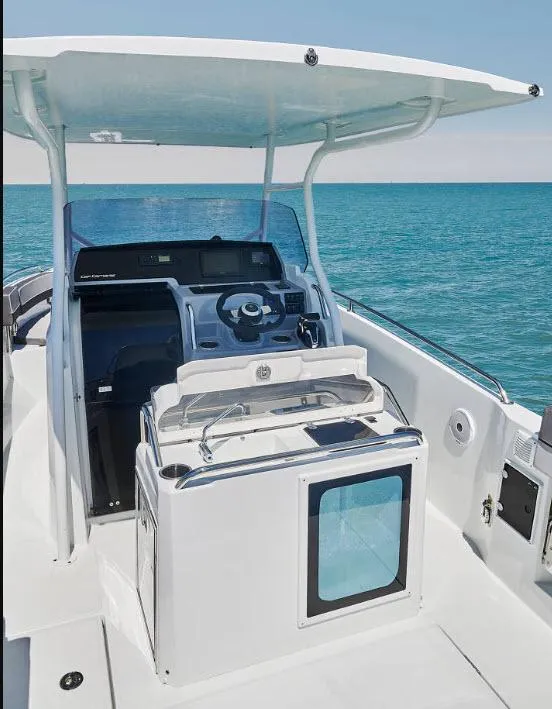 Slide: The Image of 2023 Jeanneau Leader 7.5CC S3 boat interior with steering console, ocean view. - 7