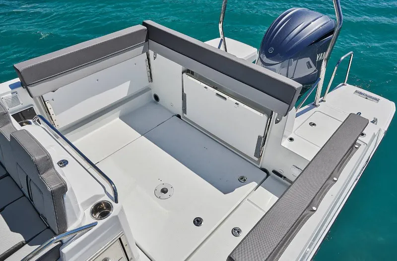 Slide: The Image of 2023 Jeanneau Leader 7.5CC S3 boat deck with seating and Yamaha engine. - 6