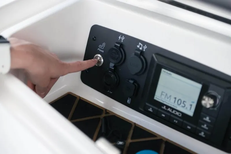 Slide: The Image of Close-up of Ingenity GS22E 2025 boat control panel with audio system. - 6
