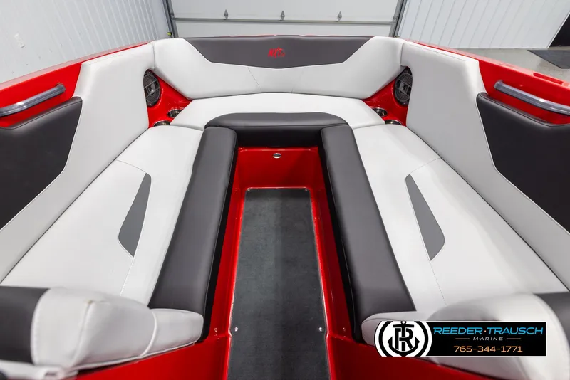 Slide: The Image of 2021 MasterCraft NXT24 boat interior with red and white seating. - 15