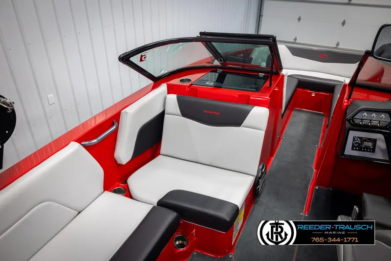 Slide: The Image of 2021 MasterCraft NXT24 boat interior with red and white seating, sleek design. - 21