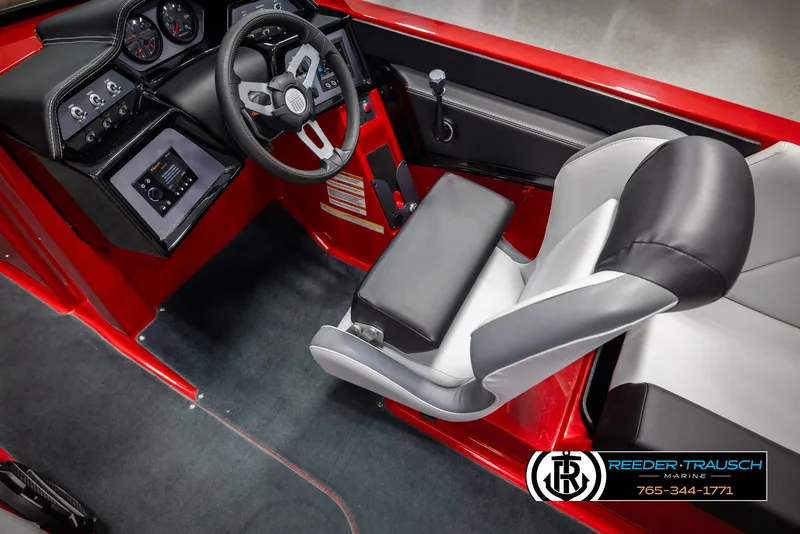 Slide: The Image of 2021 MasterCraft NXT24 boat interior with red accents and modern dashboard. - 26