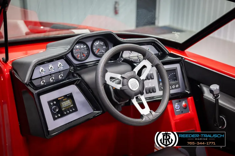Slide: The Image of 2021 MasterCraft NXT24 boat dashboard with steering wheel and control panel. - 28