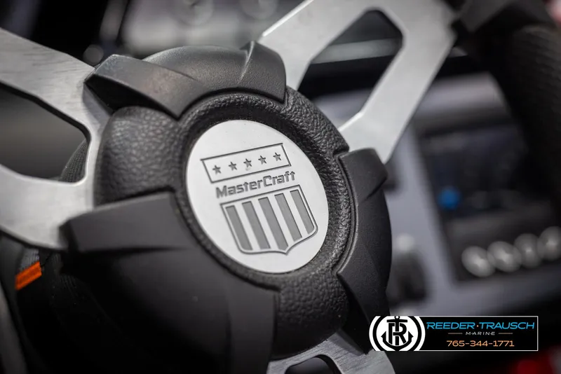 Slide: The Image of Close-up of 2021 MasterCraft NXT24 steering wheel with logo. - 29
