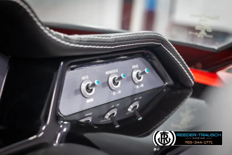 Slide: The Image of 2021 MasterCraft NXT24 dashboard controls with sleek design and stitching detail. - 33