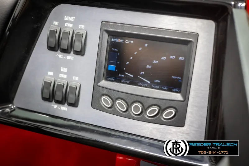 Slide: The Image of Control panel of 2021 MasterCraft NXT24 boat with digital display and switches. - 34