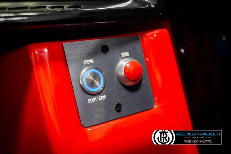 Slide: The Image of Close-up of 2021 MasterCraft NXT24 engine start/stop button panel. - 35