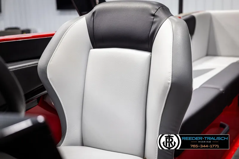 Slide: The Image of 2021 MasterCraft NXT24 boat seat, black and white upholstery, Reeder-Trausch Marine logo visible. - 37