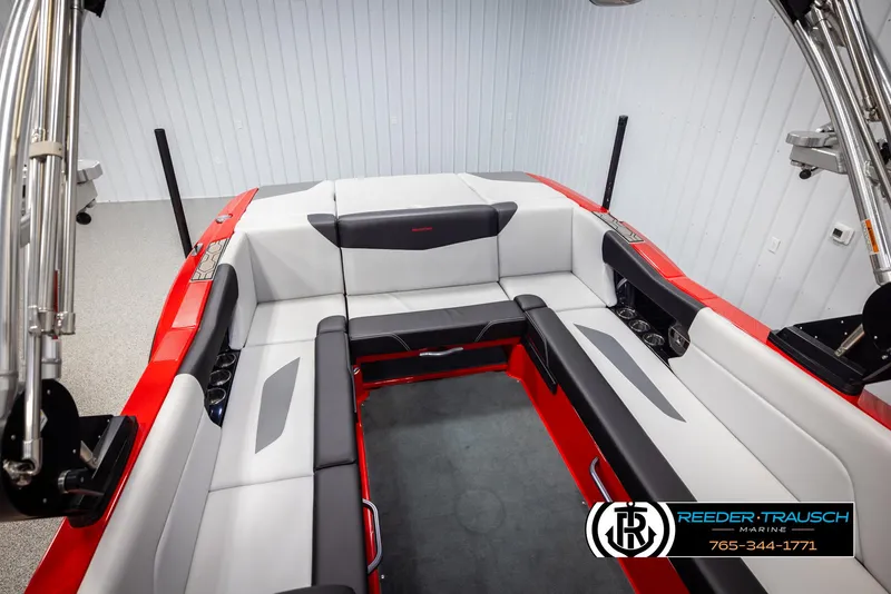 Slide: The Image of 2021 MasterCraft NXT24 boat interior with red and white seating. - 45