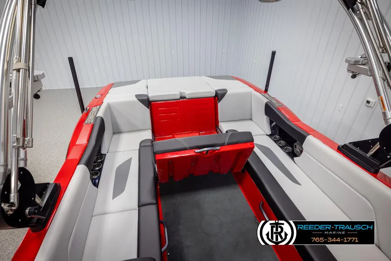 Slide: The Image of 2021 MasterCraft NXT24 boat interior with red and gray seating, sleek design. - 46