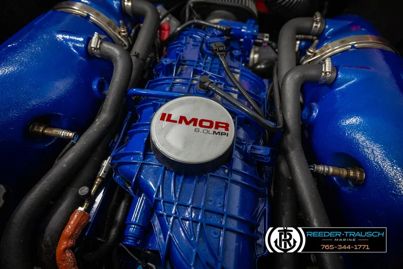 Slide: The Image of 2021 MasterCraft NXT24 Ilmor engine close-up with blue components. - 49