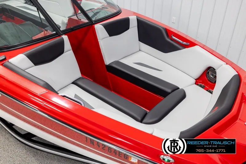 Slide: The Image of 2021 MasterCraft NXT24 boat interior with red and white seating. - 9