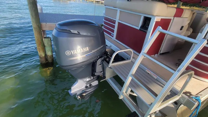 Slide: The Image of 2012 Bennington 2274 GL pontoon boat with Yamaha outboard motor docked on water. - 12