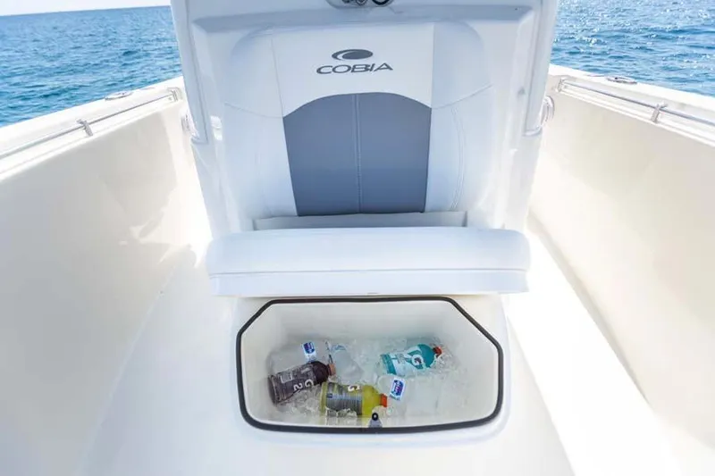 Slide: The Image of Cobia 280 Center Console 2020 with built-in cooler and drinks on ice. - 10