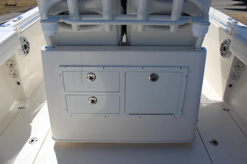 Slide: The Image of 2020 Cobia 280 Center Console boat interior with storage compartments and seating. - 12