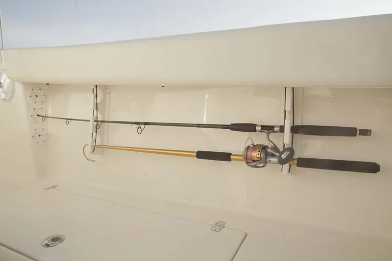 Slide: The Image of Fishing rods stored on a 2020 Cobia 280 Center Console boat. - 13