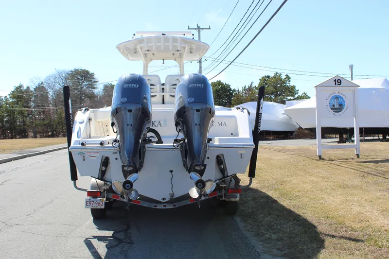 Slide: The Image of 2020 Cobia 280 Center Console boat with dual engines on a trailer. - 5