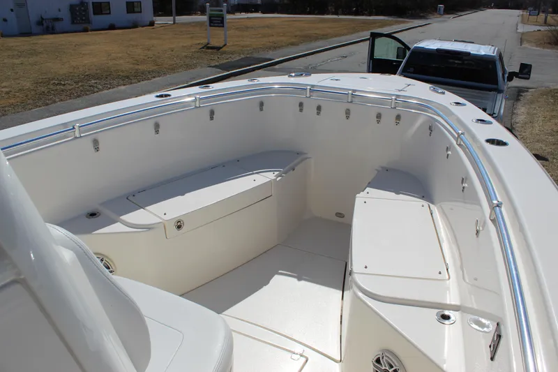 Slide: The Image of 2020 Cobia 280 Center Console boat interior with seating and storage compartments. - 7