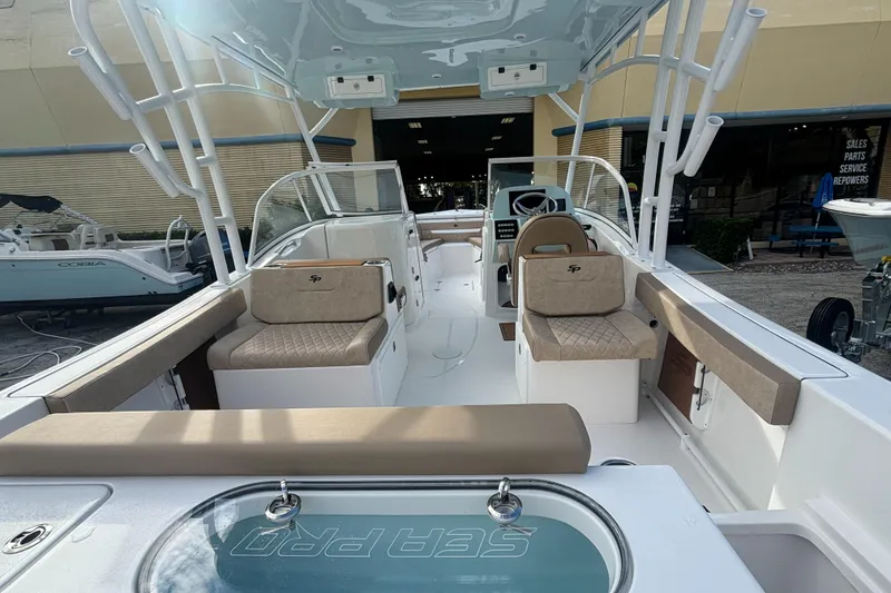 Slide: The Image of 2025 Sea Pro 240 Dual Console boat interior with seating and helm. - 10