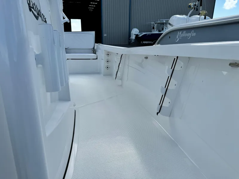 Slide: The Image of 2025 BlackJack 256 Bay boat interior, featuring sleek white deck and seating. - 15