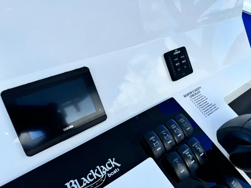 Slide: The Image of Control panel of 2025 BlackJack 256 Bay boat with Yamaha display and switches. - 17