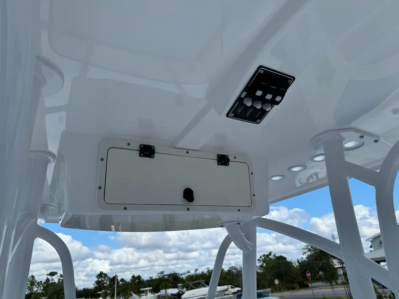 Slide: The Image of 2025 BlackJack 256 Bay boat console with storage compartment and control panel. - 18