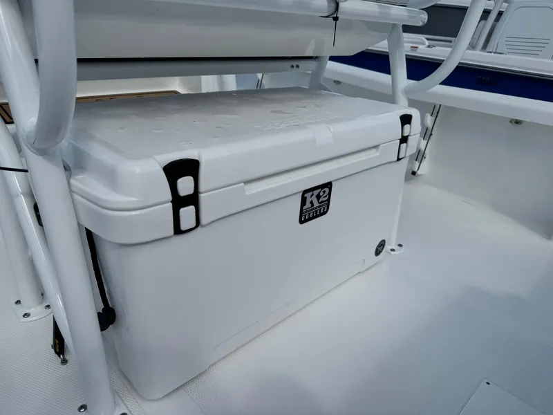 Slide: The Image of White K2 cooler on 2025 BlackJack 256 Bay boat deck. - 21
