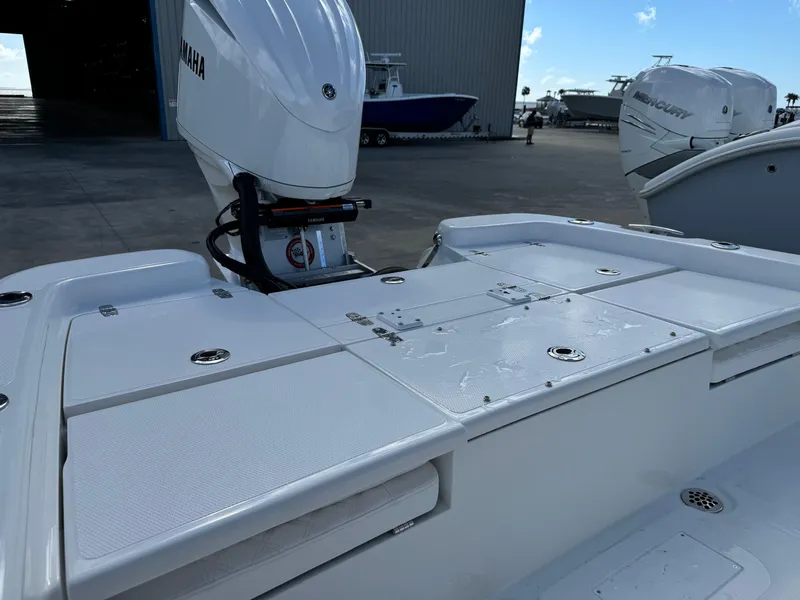 Slide: The Image of 2025 BlackJack 256 Bay boat with Yamaha engine at marina. - 23