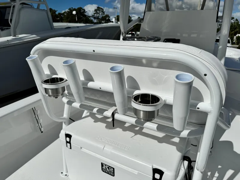 Slide: The Image of 2025 BlackJack 256 Bay boat with rod holders and cooler on deck. - 27